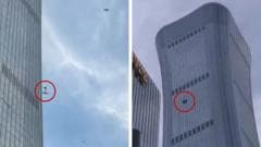 Debris falls after plane hits Beijing's tallest building