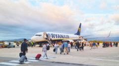 Ryanair 'reluctantly' agrees to let parents sit with children for free
